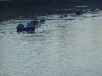 People on boat sailing in river