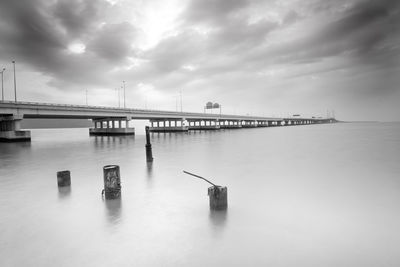 Bridge over sea against sky