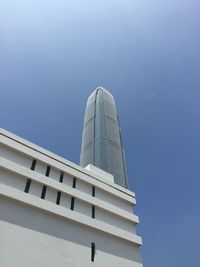 Low angle view of international finance centre against clear sky on sunny day