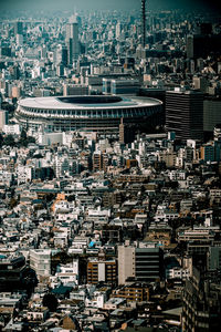 High angle view of illuminated buildings in city at night