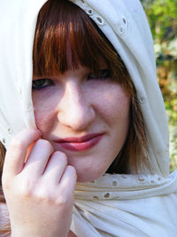 Close-up portrait of woman wearing scarf