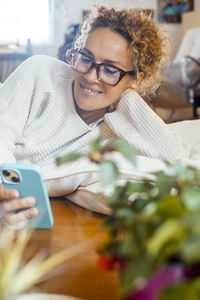 Portrait of young woman using mobile phone