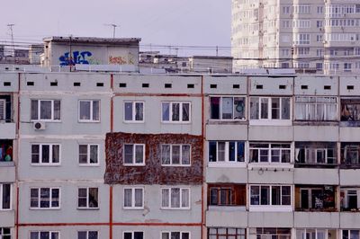 Low angle view of buildings in city against sky