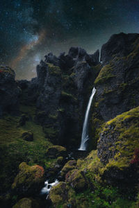 Low angle view of waterfall in forest