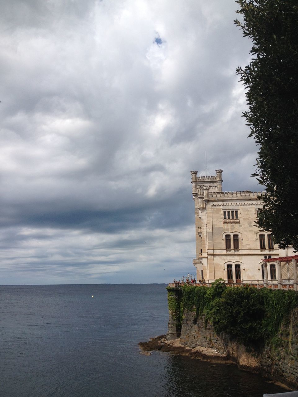 building exterior, architecture, built structure, sky, water, city, cloud - sky, waterfront, residential building, residential structure, reflection, building, house, tree, tower, cloud, outdoors, sea, day, no people