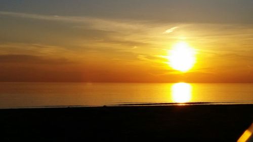 Scenic view of sunset over sea