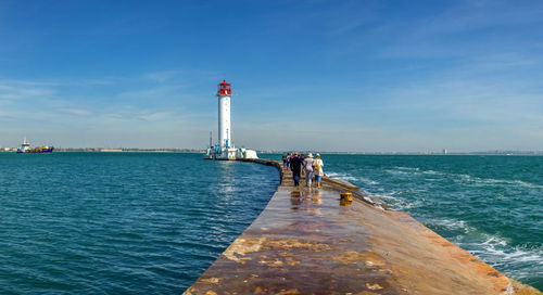 Excursion to odessa lighthouse in the harbor of odessa seaport, on a sunny summer day