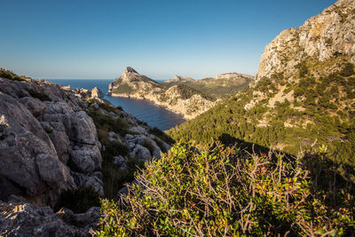 Scenic view of mountains against clear blue sky, cap formentor