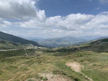 Scenic view of landscape and mountains against sky