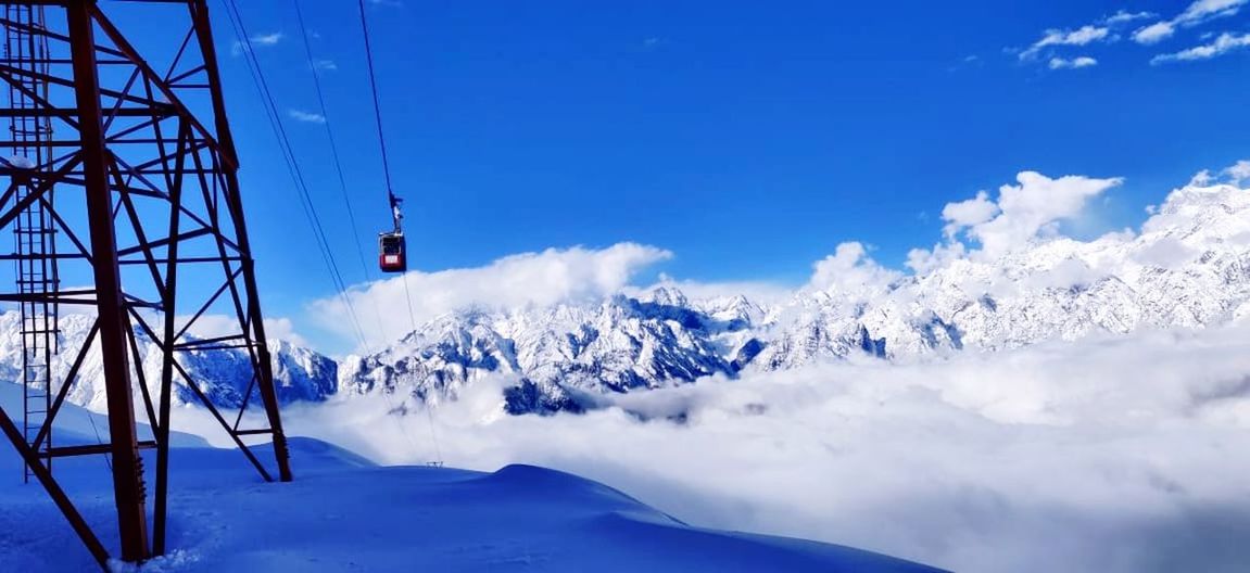 snow, mountain, cold temperature, sky, winter, cloud - sky, scenics - nature, blue, beauty in nature, snowcapped mountain, nature, day, mountain range, tranquil scene, environment, white color, non-urban scene, tranquility, no people, outdoors, ski resort, mountain peak