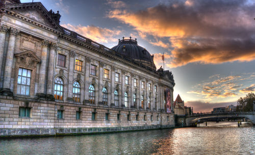 Low angle view of building against cloudy sky