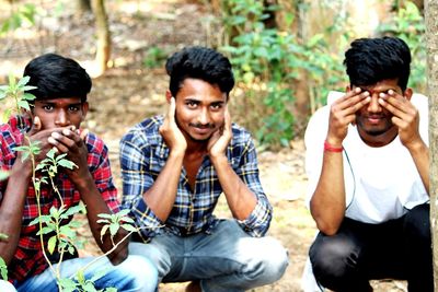 Portrait of friends sitting outdoors