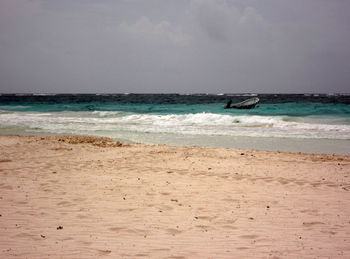 Scenic view of beach against sky