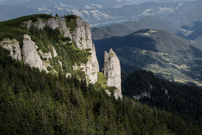 Scenic view of tree mountains against sky