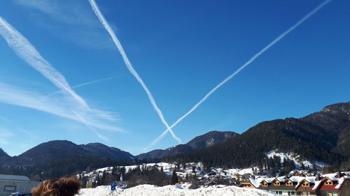 Scenic view of mountains against blue sky