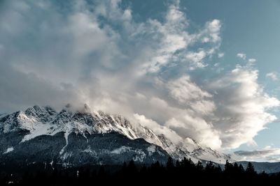 Scenic view of snowcapped mountains against sky