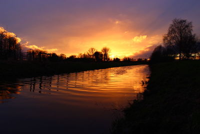 Scenic view of lake at sunset