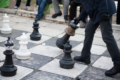 Low section of people on chess board