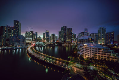 Aerial view of city lit up at night