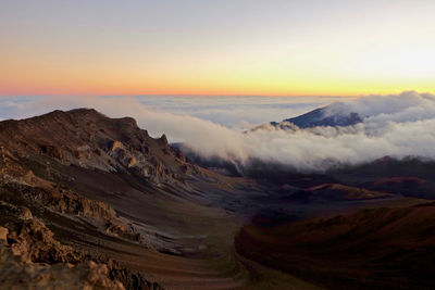 Panoramic view of volcanic landscape against sky during sunset