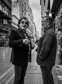 People standing on street in city