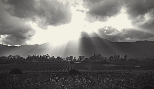 Scenic view of mountains against cloudy sky