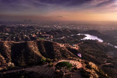 Aerial view of cityscape against sky during sunset