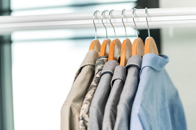 Close-up of clothes hanging on rack