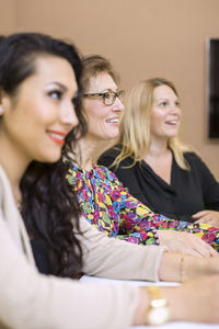 Smiling businesswomen in meeting at creative office