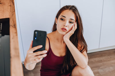 Young woman using mobile phone