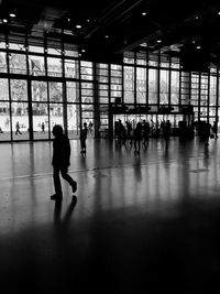 Silhouette of woman walking on floor