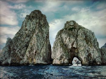 Scenic view of sea against cloudy sky