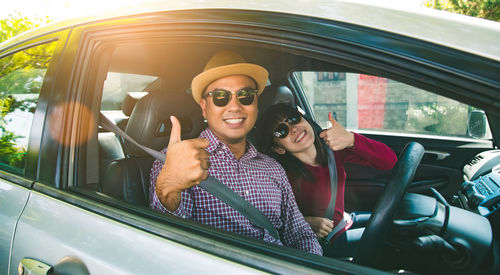 Portrait of people sitting in car