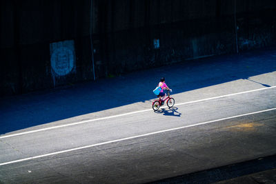 Man riding bicycle on road