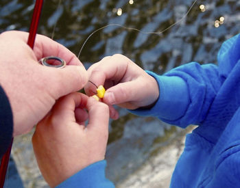 Cropped image of hand holding outdoors