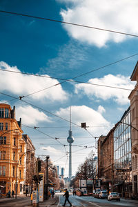 City street and buildings against sky