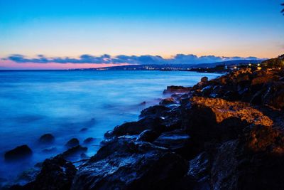 Scenic view of sea against sky at sunset