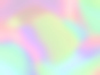 Defocused image of rainbow against bright sun