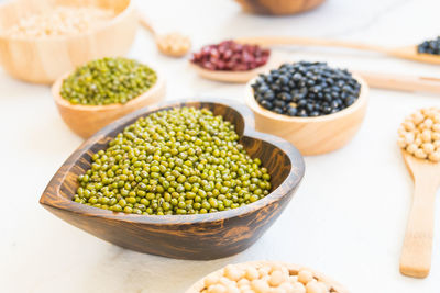 Close-up of various beans over white background