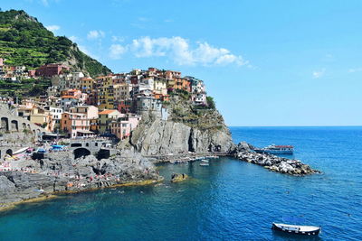 View of sea with houses in background