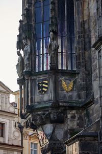 Low angle view of statue against historic building