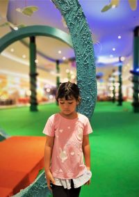 Full length of cute girl standing indoors