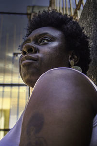 Close-up of woman with afro hair looking away