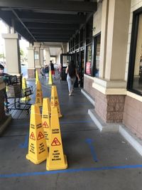 Rear view of people walking in city