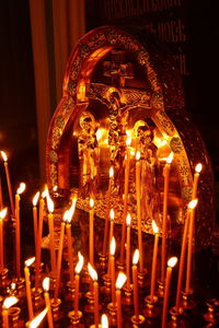 Illuminated candles in temple building