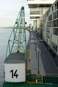 Bridge over river against buildings in city