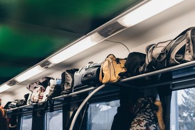 Low angle view of bags in train