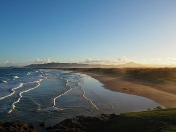 Scenic view of sea against clear blue sky