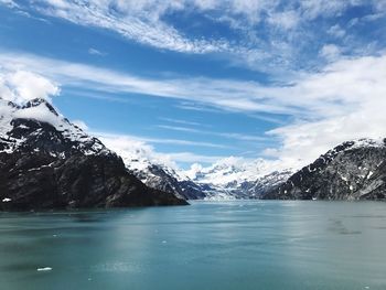 Scenic view of lake and mountains against sky