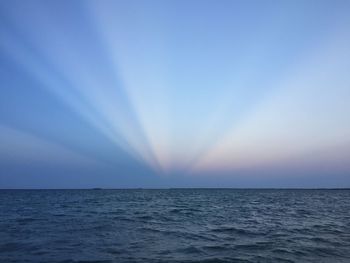 Scenic view of sea against blue sky